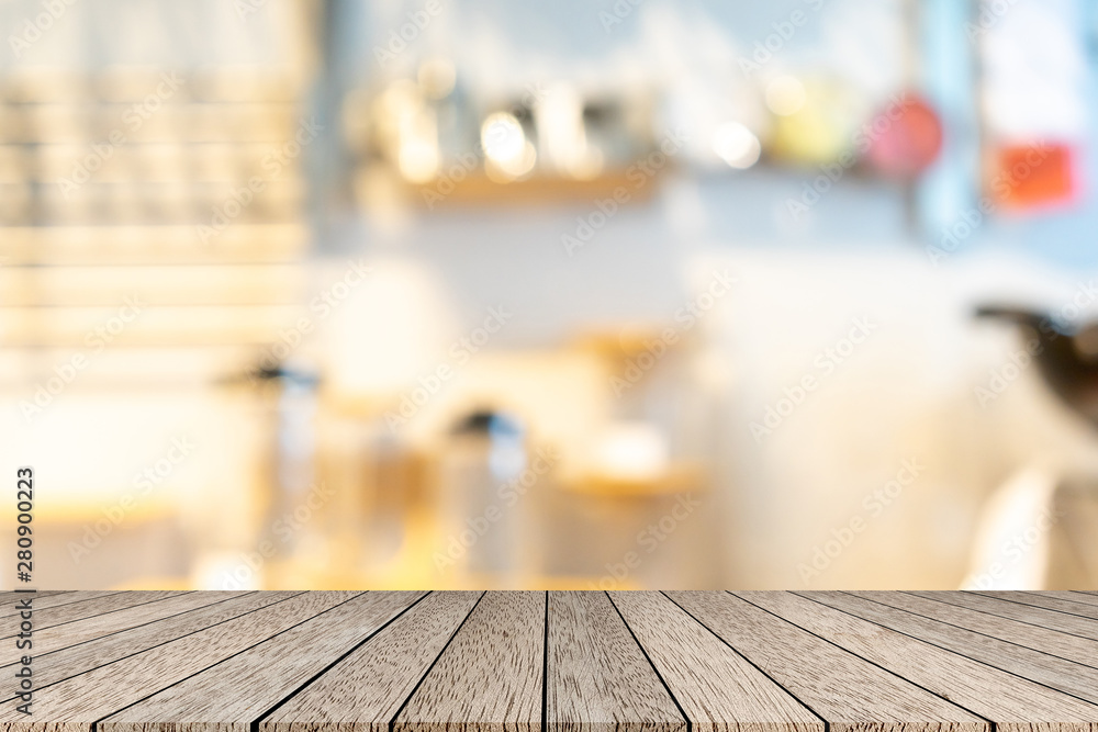 abstract blur inside restaurant with wood table for show ,promote product or content on display concept abstract blur inside restaurant with wood table for show ,promote product or content on display concept