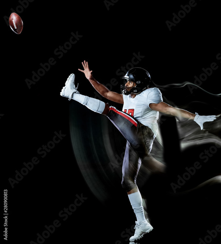 one african american football player man studio shot isolated on black background with light painting with blurred motion speed effect