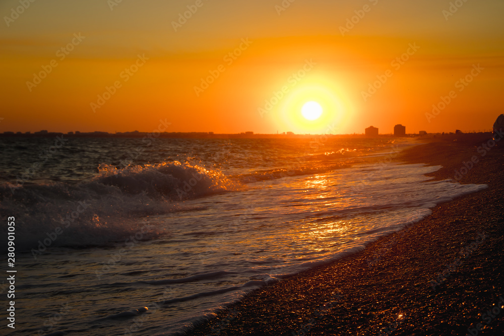 Sea waves. Sea of Crimea. High waves at sunset. Sunny day at sea. Background blue waves. Sand beach. Clean beach.