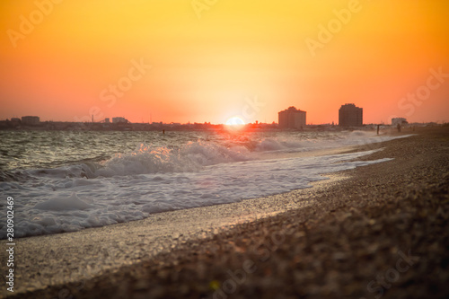Sea waves. Sea of Crimea. High waves at sunset. Sunny day at sea. Background blue waves. Sand beach. Clean beach.