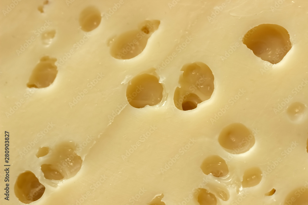 Cheese texture, closeup. Hard seasoned cheese structure in macro shot Cheese texture, closeup. Hard seasoned cheese structure in macro shot
