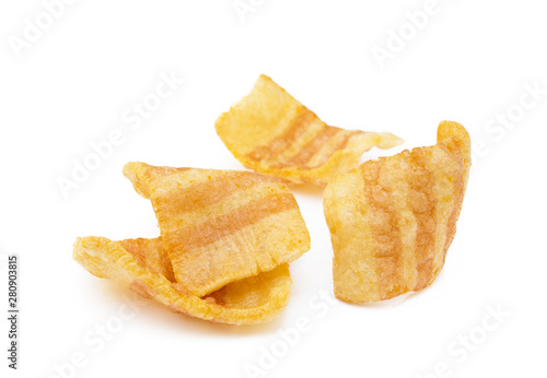 Fried wheat-potato snack with smoked bacon flavor isolated on white background