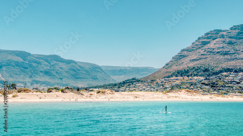 Paddleboarding off the coast of Hout Bay Beach in Cape Town.