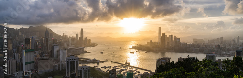 Panoramic landscape or cityscape of Hong Kong island  Victoria harbour  and Kowloon city at sunset  view from Red incense burner summit. Asia travel destination or Asian tourism concept  banner size