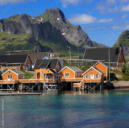 Traditional yellow colourful Norwegian fishing houses in Sakrisøy Island, Reine area, Lofoten Islands in northern Norway