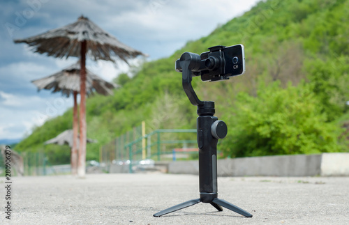 Image stabilizer with mobile phone on the beach