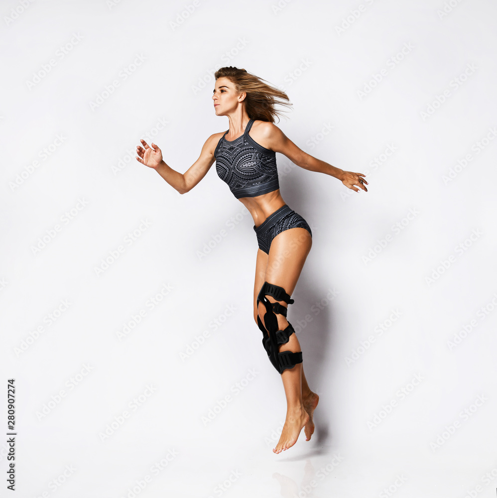 Woman with knee brace. Isolated. Woman with knee brace. Isolated.