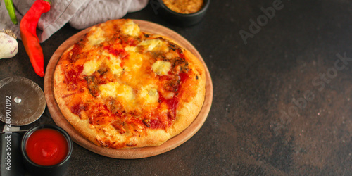 pizza with different types of cheese (tomato sauce and other ingredients, snack). top food background. copy space