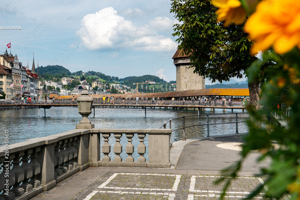 view of the Chapelbridge in Lucerne with flowers in front