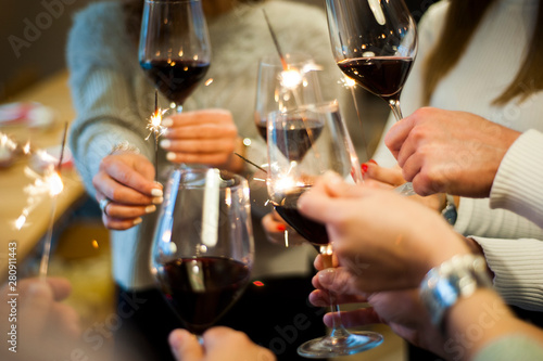 Friends celebrate their birthday at the local winery. Elegant glasses with homemade quality wine