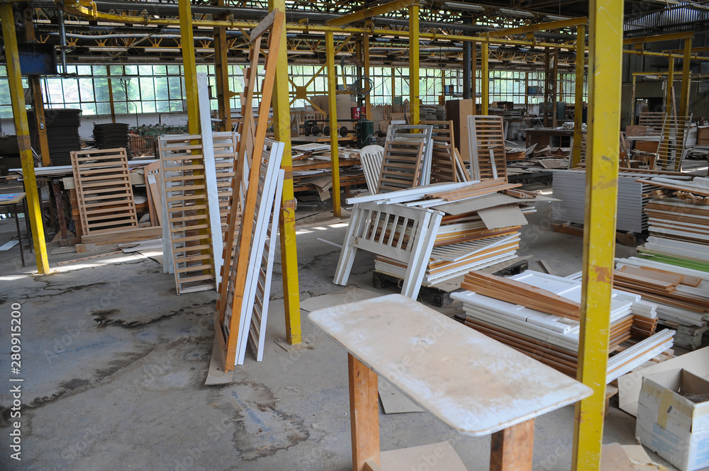Wood processing machines and pieces of products in a furniture factory