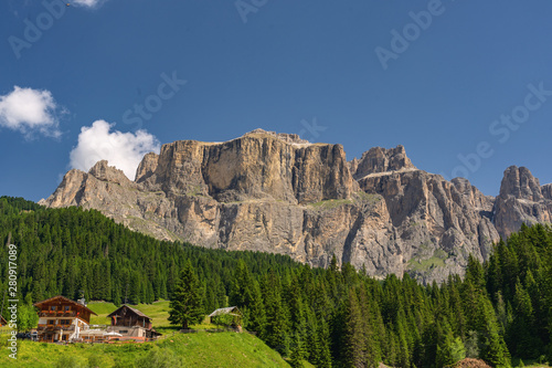 Beautiful landscape with building near rocky mountain