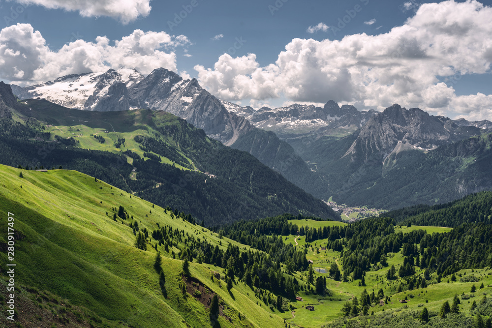 Scenic Alps with green mountain under sky