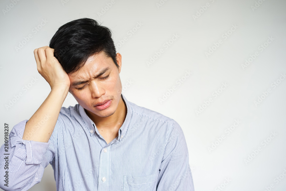 close up young asian man massage head from headache or migraine symptom at home office , healthcare life concept close up young asian man massage head from headache or migraine symptom at home office , healthcare life concept