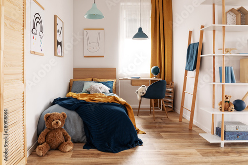 Multifunctional bedroom and workspace interior with bed and desk