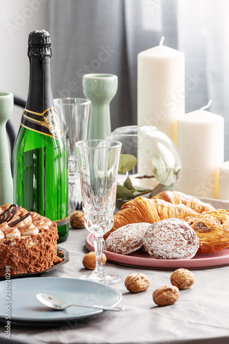 Closeup of dining table set for birthday party with champagne
