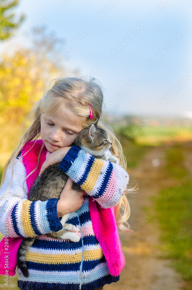 child walking with his cute cat alone child walking with his cute cat alone