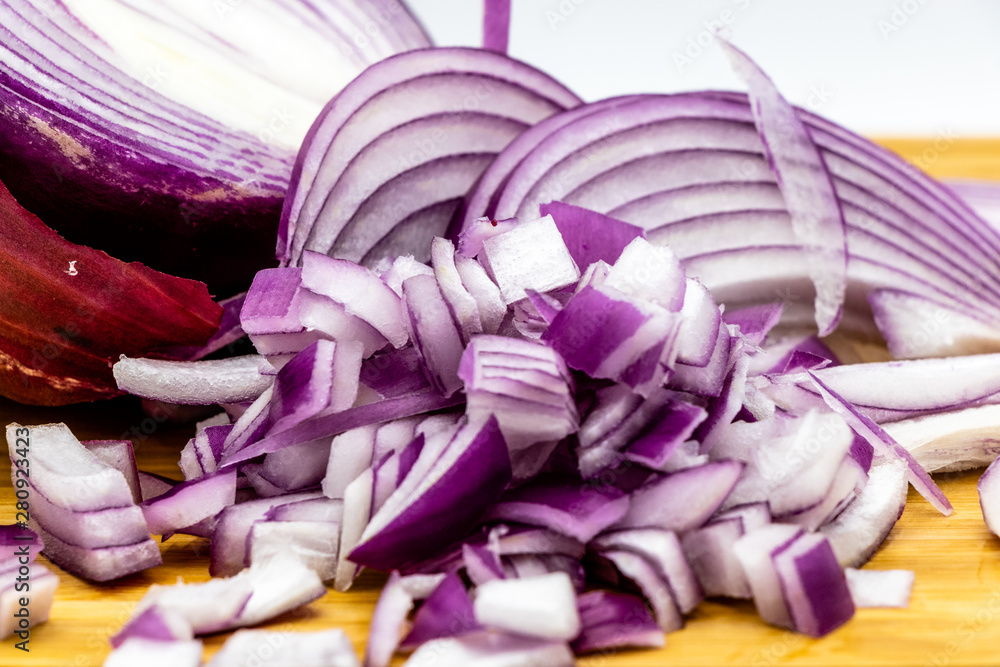 Fototapeta premium Red onions on a wooden cutting board. Calgary, alberta Canada