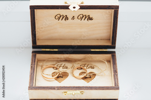 wedding gold rings in a box. wedding ceremony gathering bride and groom.