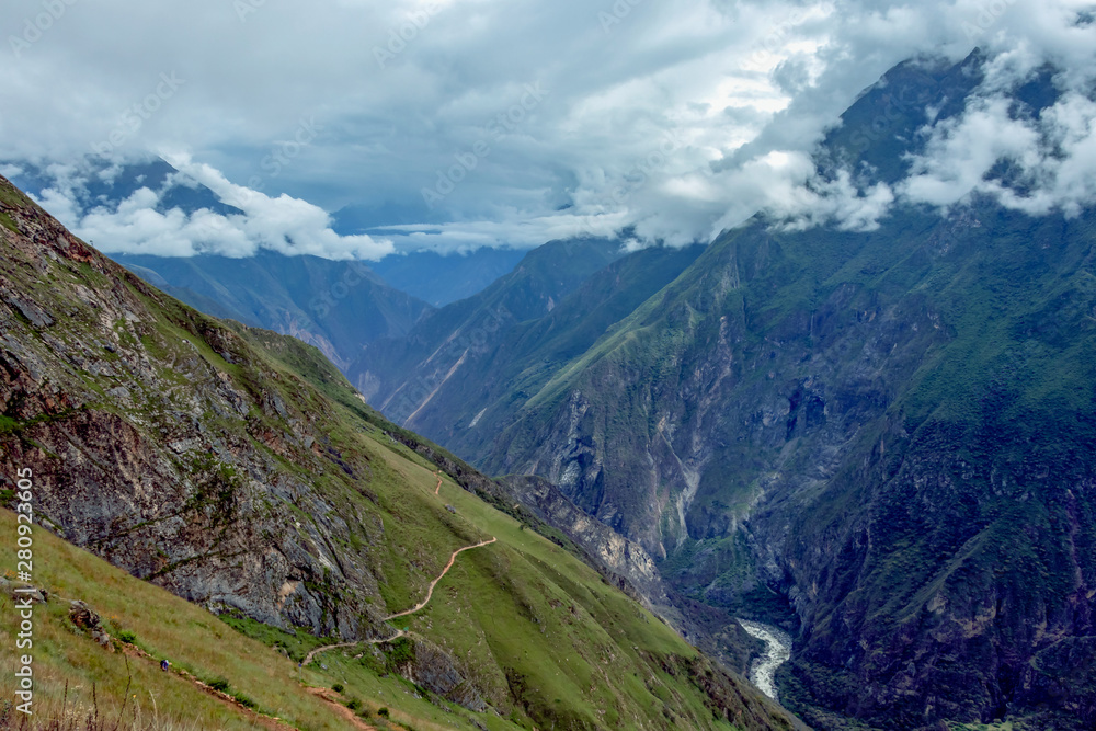 Apurimac river : Green steep slopes of valley with water in the middle, the Choquequirao trek, Peru Apurimac river : Green steep slopes of valley with water in the middle, the Choquequirao trek, Peru