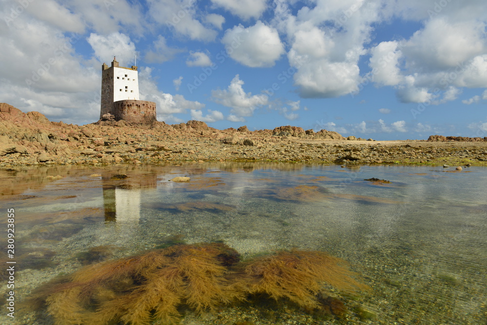 Seymour tower, Jersey, U.K. 19th century military tower at low tide in the Summer.