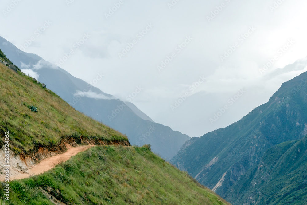 Hiking path at high altitude Peruvian mountains, the Choquequirao trek to Machu Picchu, alternative to Inca Trail, Peru