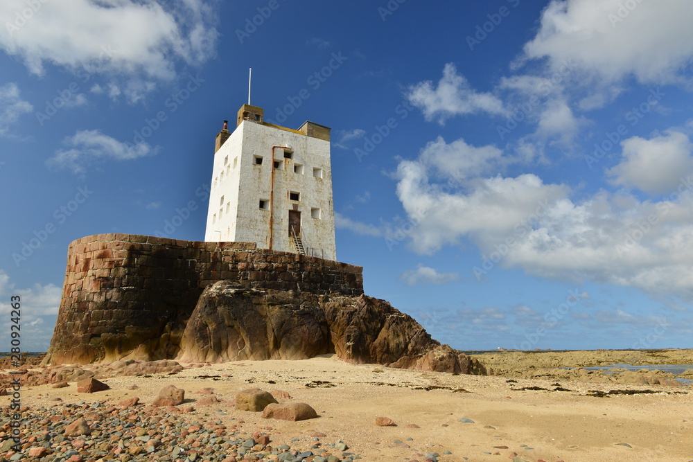 Seymour Tower, Jersey, U.K. 19th century military landmark 1 mile from shore at low tide in the Summer.