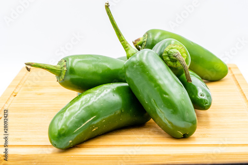 Jalapeno peppers on a wooden cutting board. Calgary, Alberta, Canada