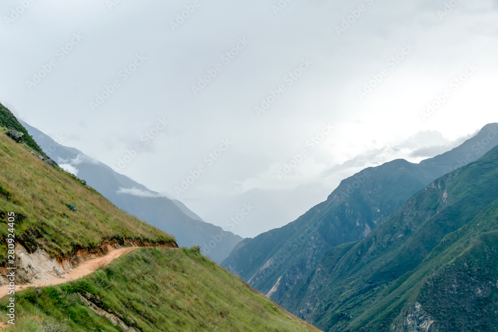 Naklejka premium Hiking path at high altitude Peruvian mountains, the Choquequirao trek to Machu Picchu, alternative to Inca Trail, Peru