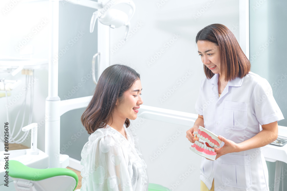 Portrait of a dentist being positive about oral health of patient Portrait of a dentist being positive about oral health of patient