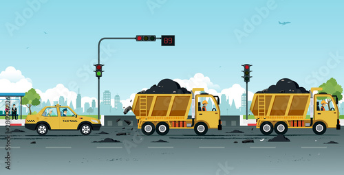 Dump truck drivers make dirt roads with soil.