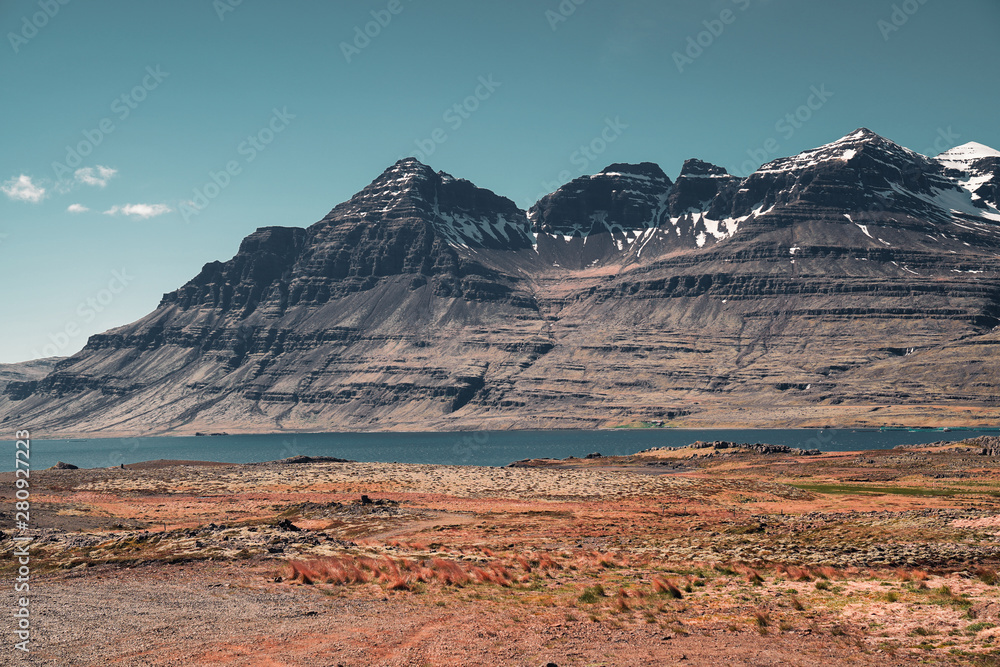 Eastern fjords Iceland. Beautiful mountains covered by snow in sunny day. 