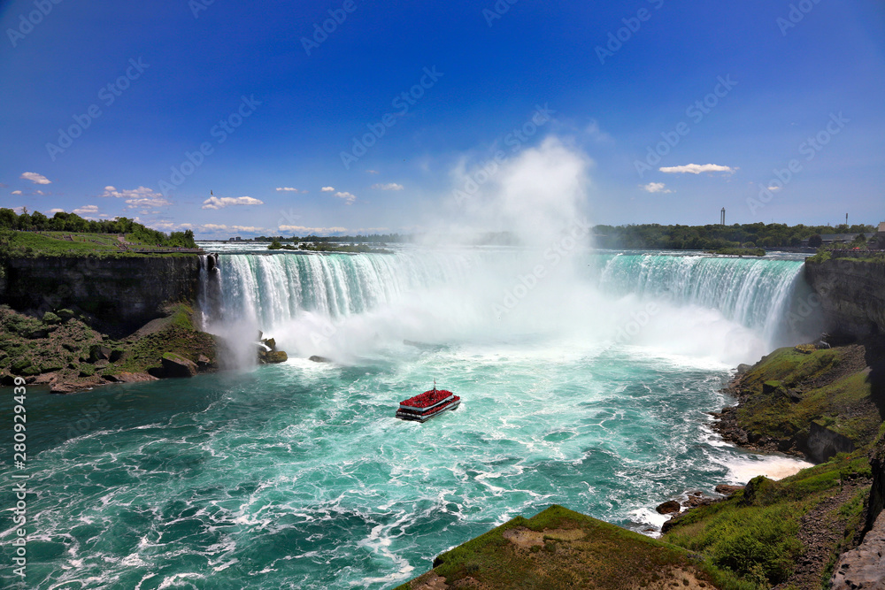 Tourists observing Niagara Falls from the boat Tourists observing Niagara Falls from the boat