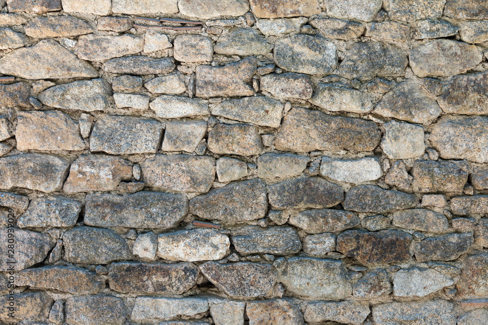Fototapeta premium murs anciens formés de pierres de tailles differentes