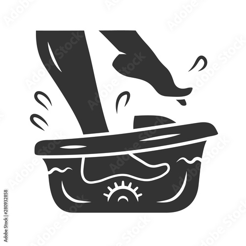 Foot spa bath massager glyph icon. Relaxing massage. Beauty device for home use. Pedicure electric instrument. Silhouette symbol. Negative space. Vector isolated illustration