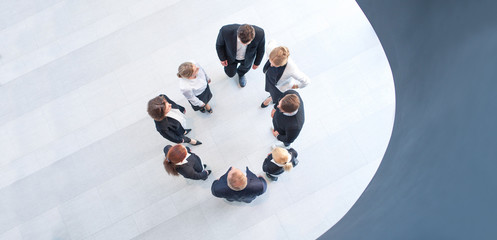Business people forming circle