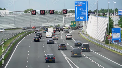 Busy traffic on Highway A10 in the South direction photo