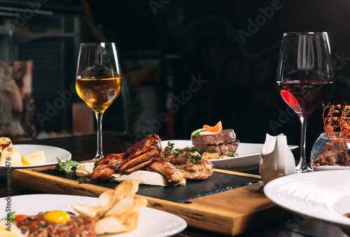 Wallpaper Mural Grilled partridge, sea bass, Tartarus.  Different dishes on the table in the restaurant. Torontodigital.ca