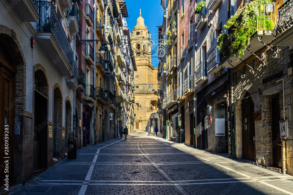 Pedestrian street in Pamplona old town with the Cathedral in the background, Navarre, Spain