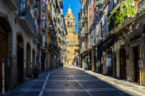 Pedestrian street in Pamplona old town with the Cathedral in the background, Navarre, Spain photo