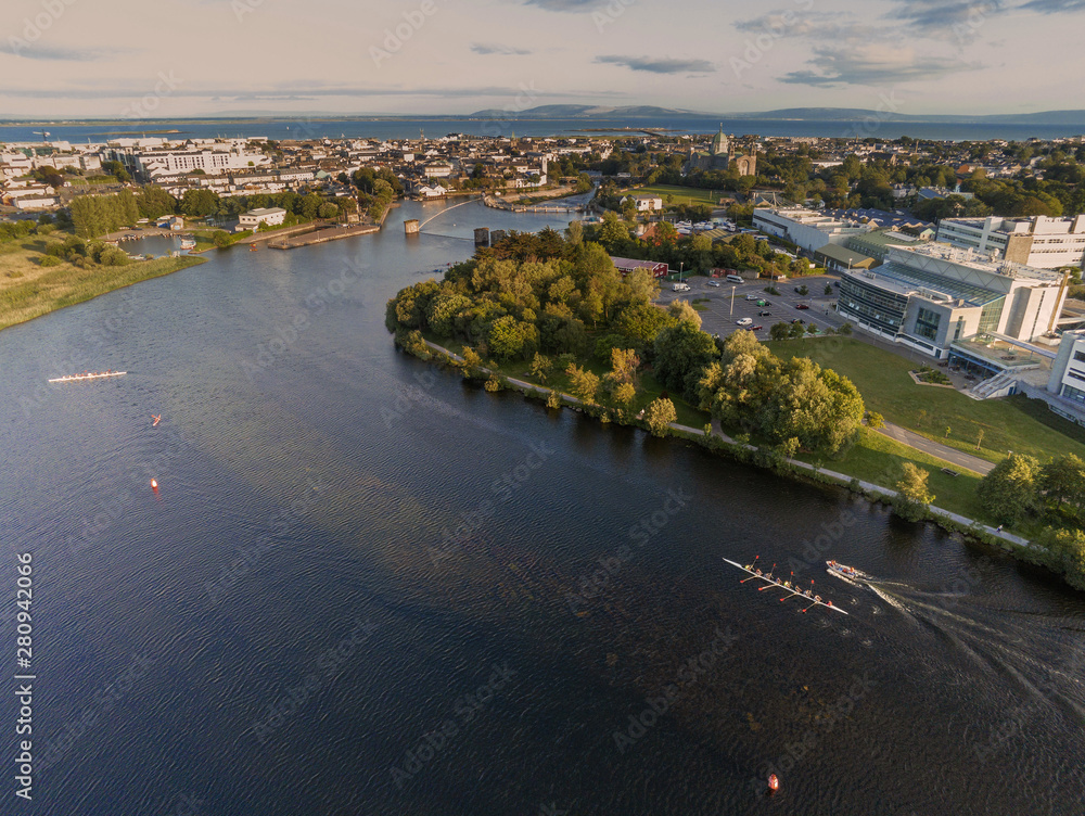 Galway city aerial view from river Corrib, big eights practice on water.