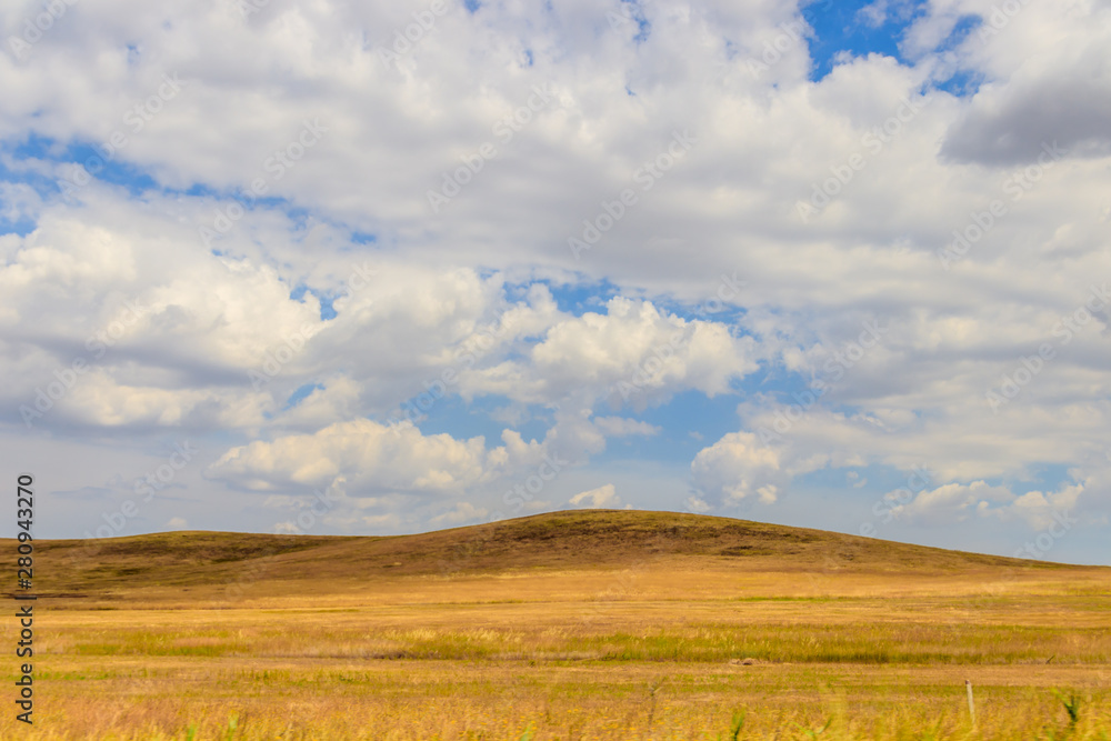 Russian open spaces. Crimea. Field. Summer Russian landscapes. . Grass and sky. Background summer landscape. Crimean fields