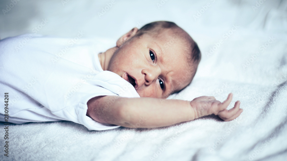 cute newborn baby lying on white blanket cute newborn baby lying on white blanket