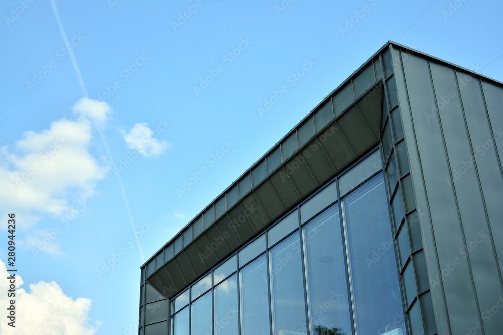 modern building with blue sky and clouds modern building with blue sky and clouds