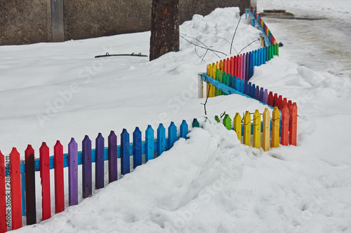Rainbow fence in the snow