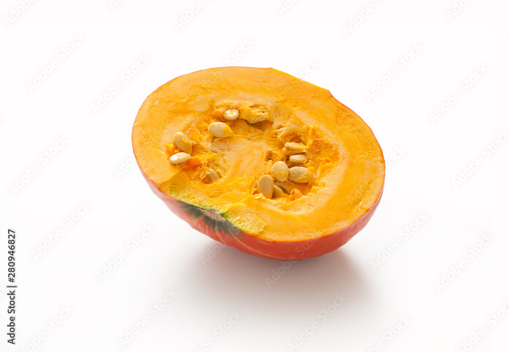 Half Pumpkin with seeds isolated on white background