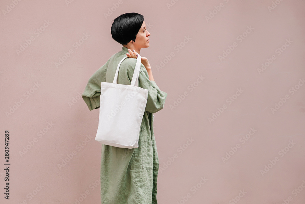 Young woman with eco bag enjoying morning. Eco friendly concept. . Young woman with eco bag enjoying morning. Eco friendly concept. .