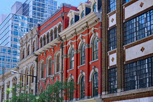 Bild auf Leinwand Ornate facades of preserved 19th century office buildings,  Toronto financial di