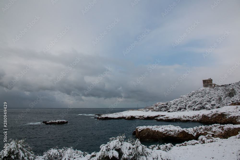 Ionian coast after a exceptional snowfall, Salento, Italy