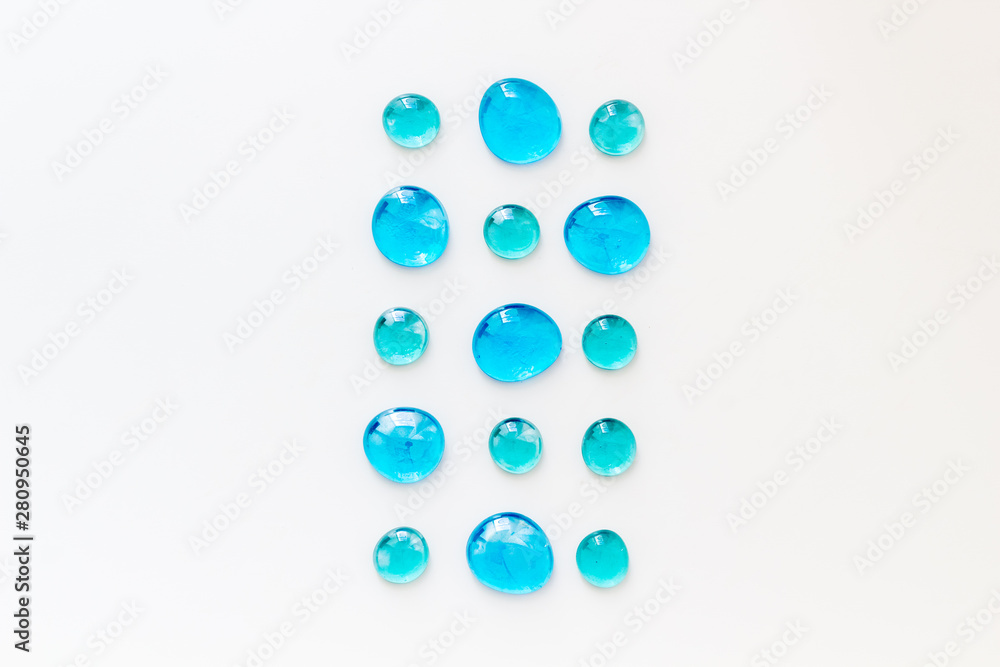 Glass stones for design and home creativity on white background top view Glass stones for design and home creativity on white background top view